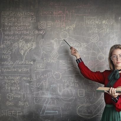 girl pointing to the chalkboard